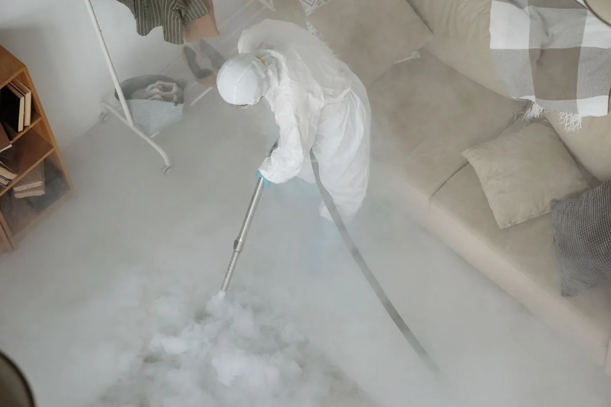 Biohazard cleanup technician in protective equipment, Braddock, VA